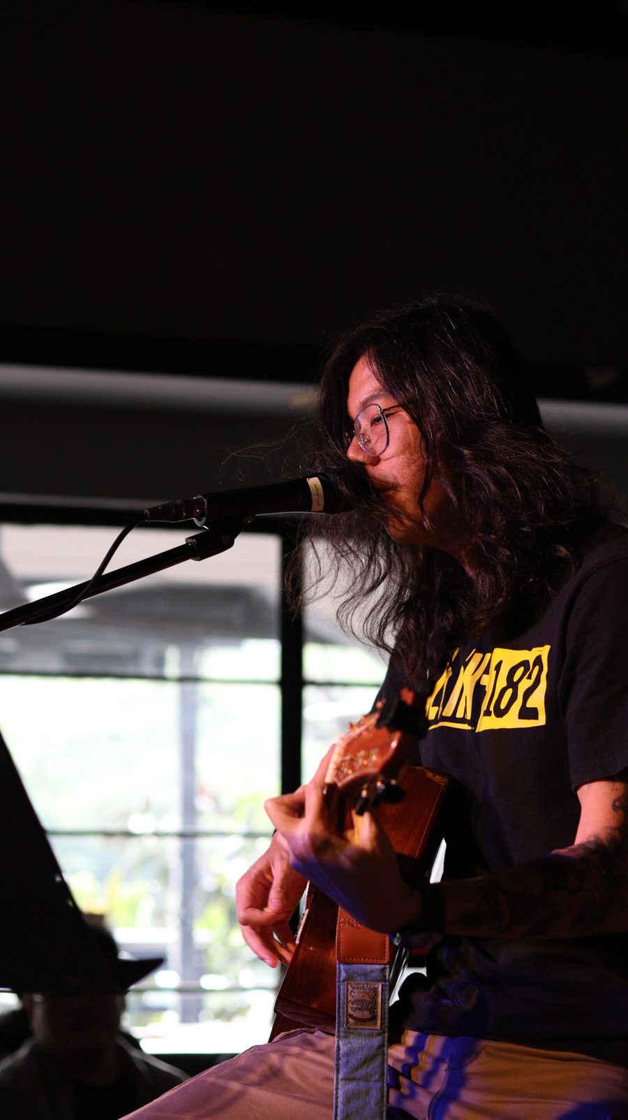 Jackson performing live with an acoustic guitar