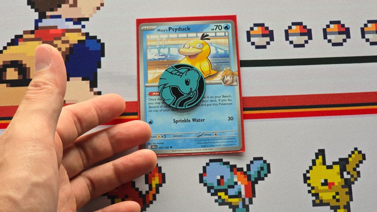 A coin placed on top of the Psyduck card to show its Ability has been used