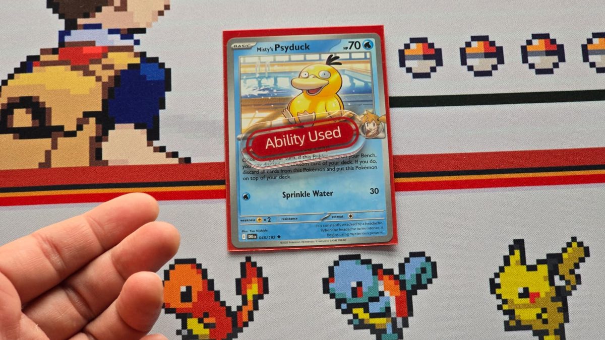 An Ability Used marker placed on top of the Psyduck card